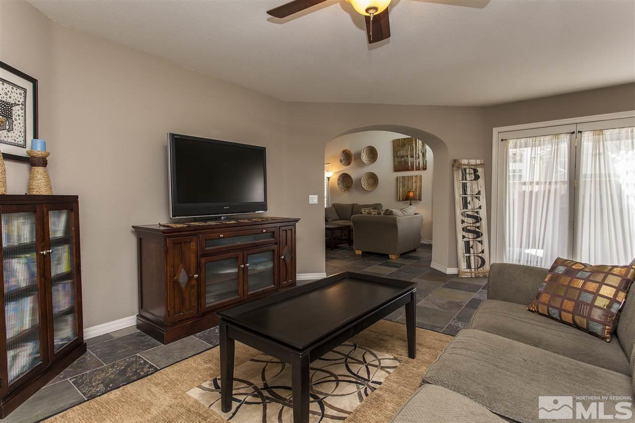 3985 Riverhaven Drive Reno, NV 89519 - Photo 5 of 25 a living room with furniture and a flat screen tv