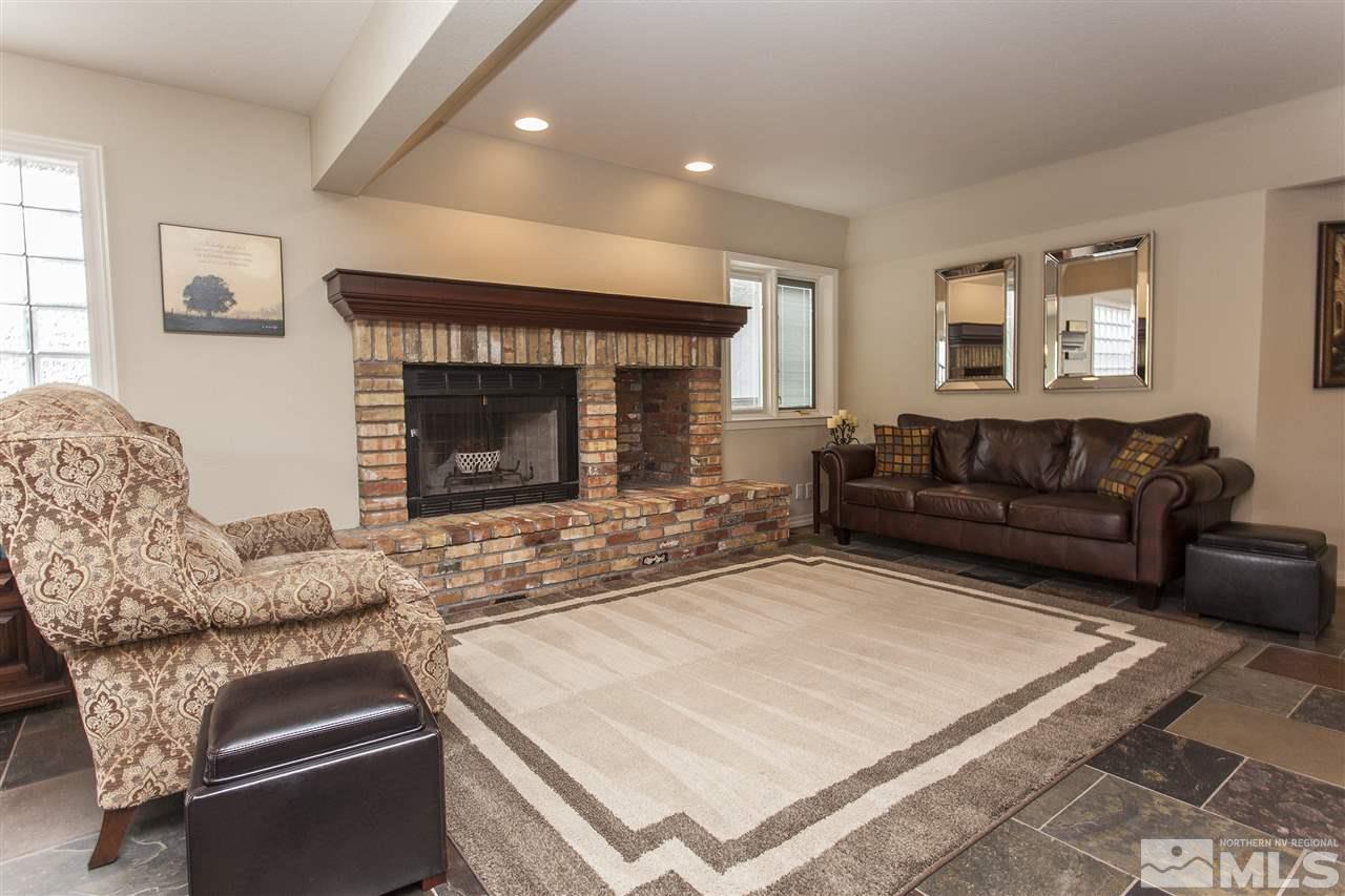 3985 Riverhaven Drive Reno, NV 89519 - Photo 6 of 25 a living room with furniture and a fireplace