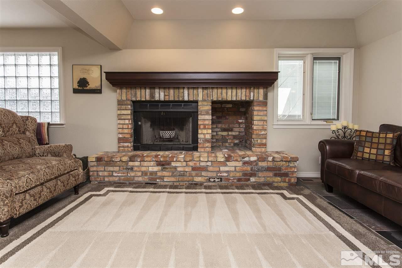 3985 Riverhaven Drive Reno, NV 89519 - Photo 7 of 25 a living room with furniture and a fireplace