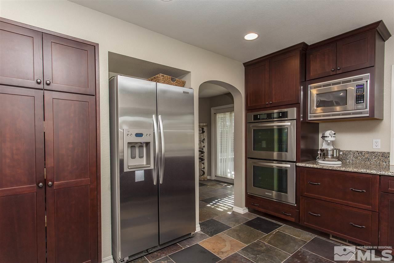 3985 Riverhaven Drive Reno, NV 89519 - Photo 10 of 25 a kitchen with granite countertop stainless steel appliances and refrigerator