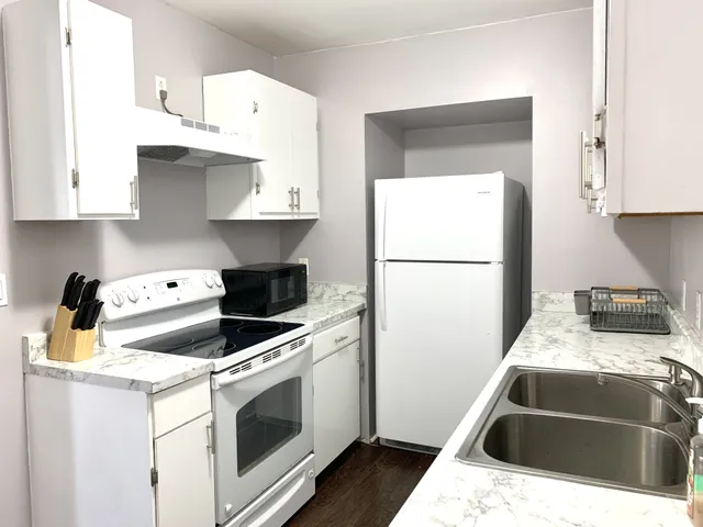 a kitchen with a stove and a refrigerator