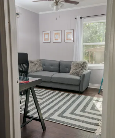 a living room with furniture and a window