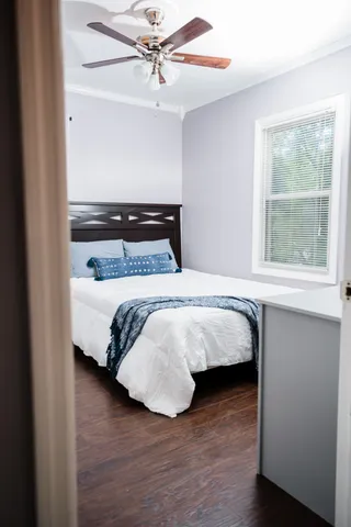 a bedroom with a bed and a dresser