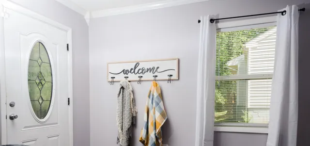 a view of a closet and a mirror
