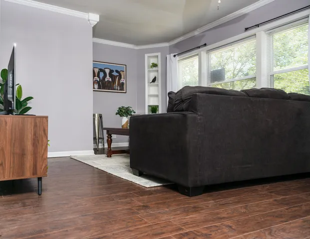 a living room with furniture and a large window