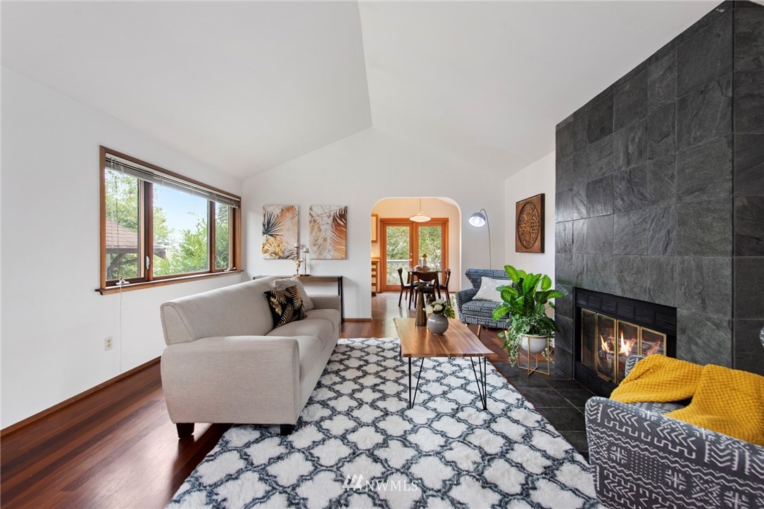 723 North 87th Street Seattle, WA 98103 - Photo 2 of 29 a living room with furniture and a fireplace