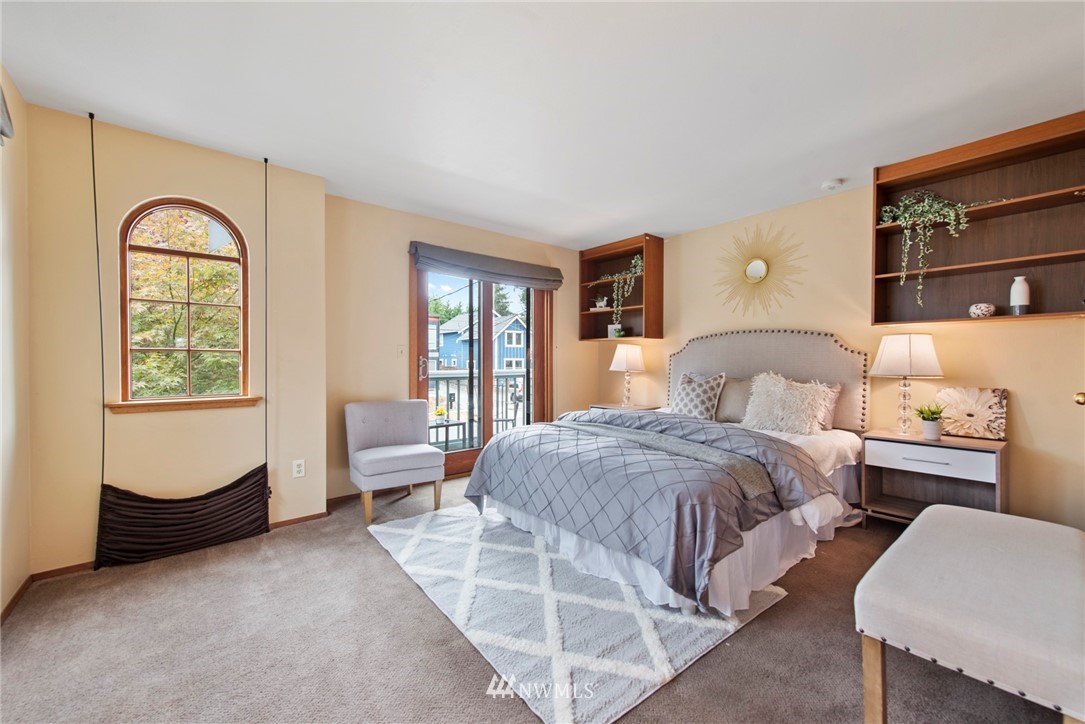 723 North 87th Street Seattle, WA 98103 - Photo 11 of 29 a bedroom with bed and a large window