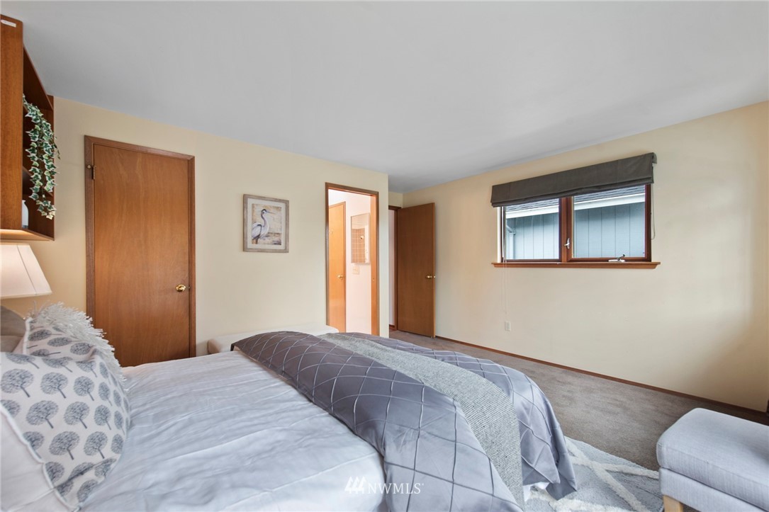 723 North 87th Street Seattle, WA 98103 - Photo 12 of 29 a bedroom with a bed and a window