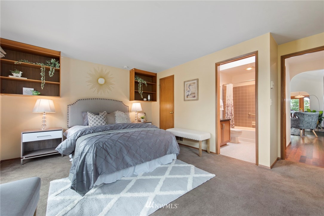 723 North 87th Street Seattle, WA 98103 - Photo 13 of 29 a bedroom with a bed and glass door