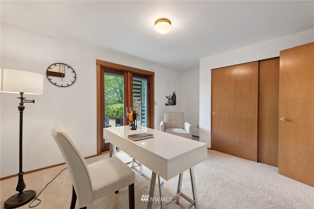 723 North 87th Street Seattle, WA 98103 - Photo 18 of 29 a view of a dining room with furniture window and outside view