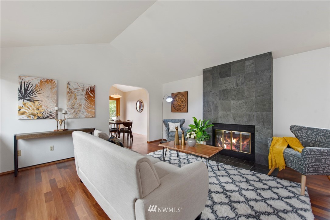 723 North 87th Street Seattle, WA 98103 - Photo 3 of 29 a living room with furniture fireplace and a fireplace