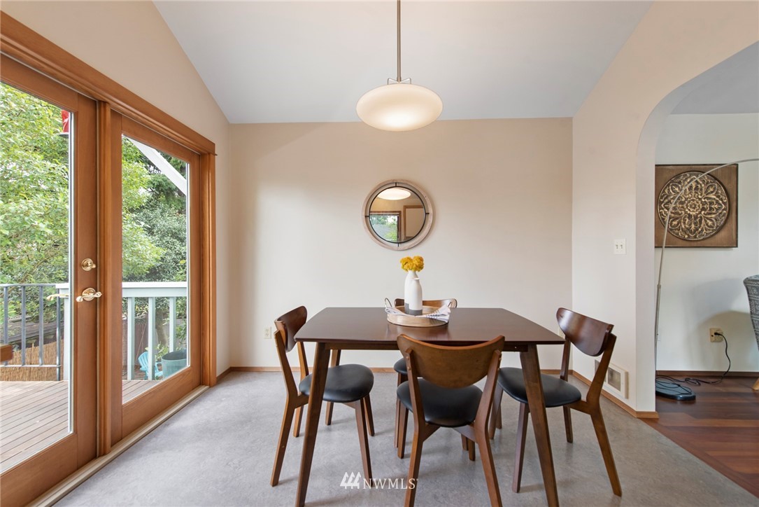 723 North 87th Street Seattle, WA 98103 - Photo 9 of 29 a view of a dining room with furniture and wooden floor
