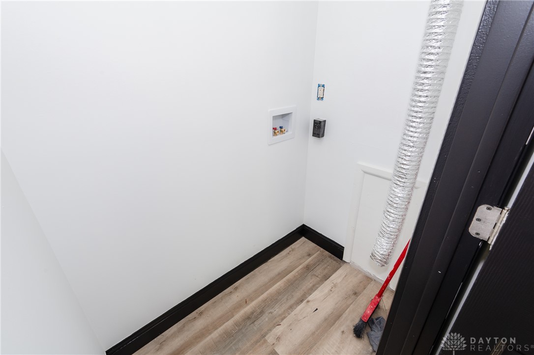 5240 Haverfield Road Dayton, OH 45432 - Photo 26 of 58 This dedicated laundry area features durable flooring, offering both functionality and simple design.
