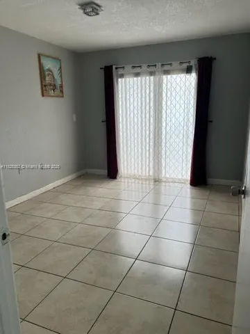 a view of a utility room with a window