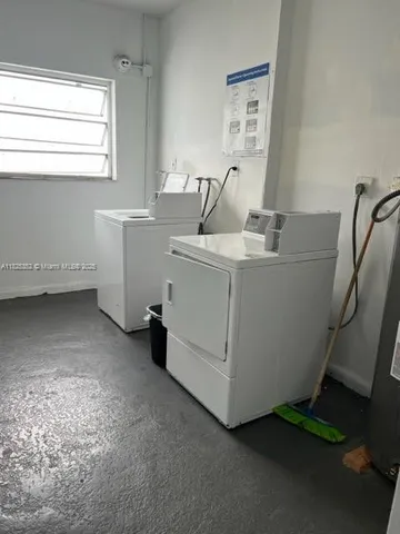 a room with a sink and cabinets