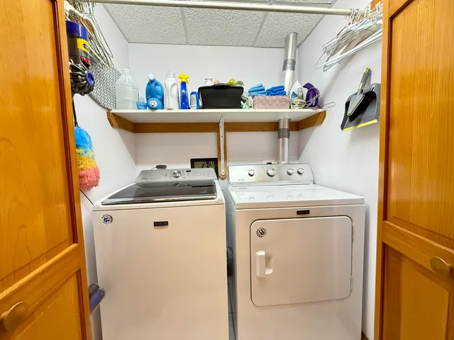 a utility room with dryer and washer