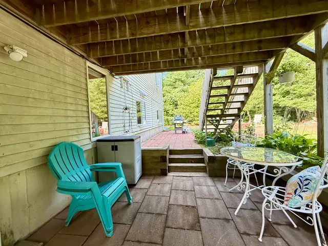 a patio with table and chairs