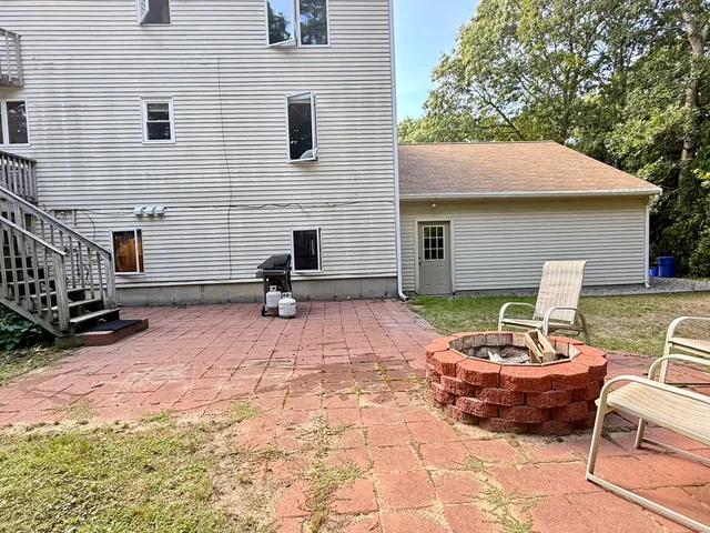 a backyard of a house with seating space