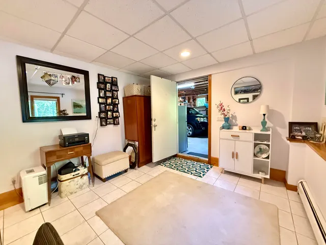 a bedroom with furniture and a dresser