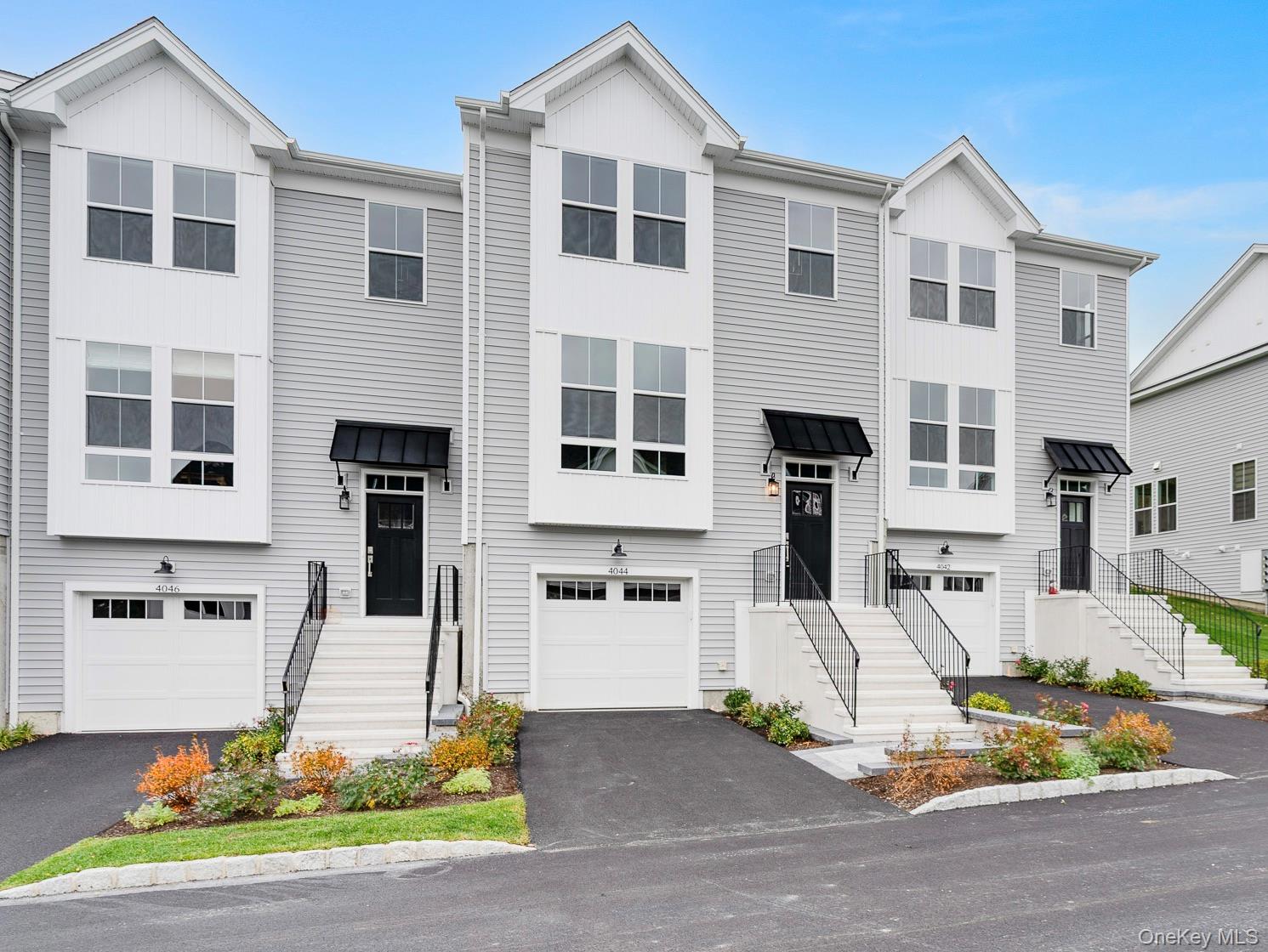 4044 Chestnut Rdg Road Fishkill, NY 12524 - Photo 1 of 26 a front view of a house with a yard and garage