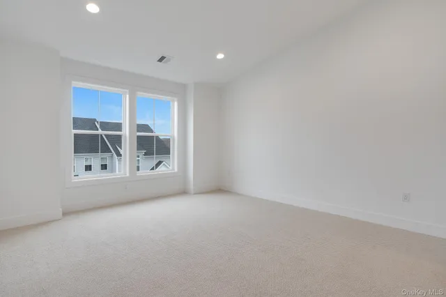 a bathroom with a sink a toilet a mirror and shower