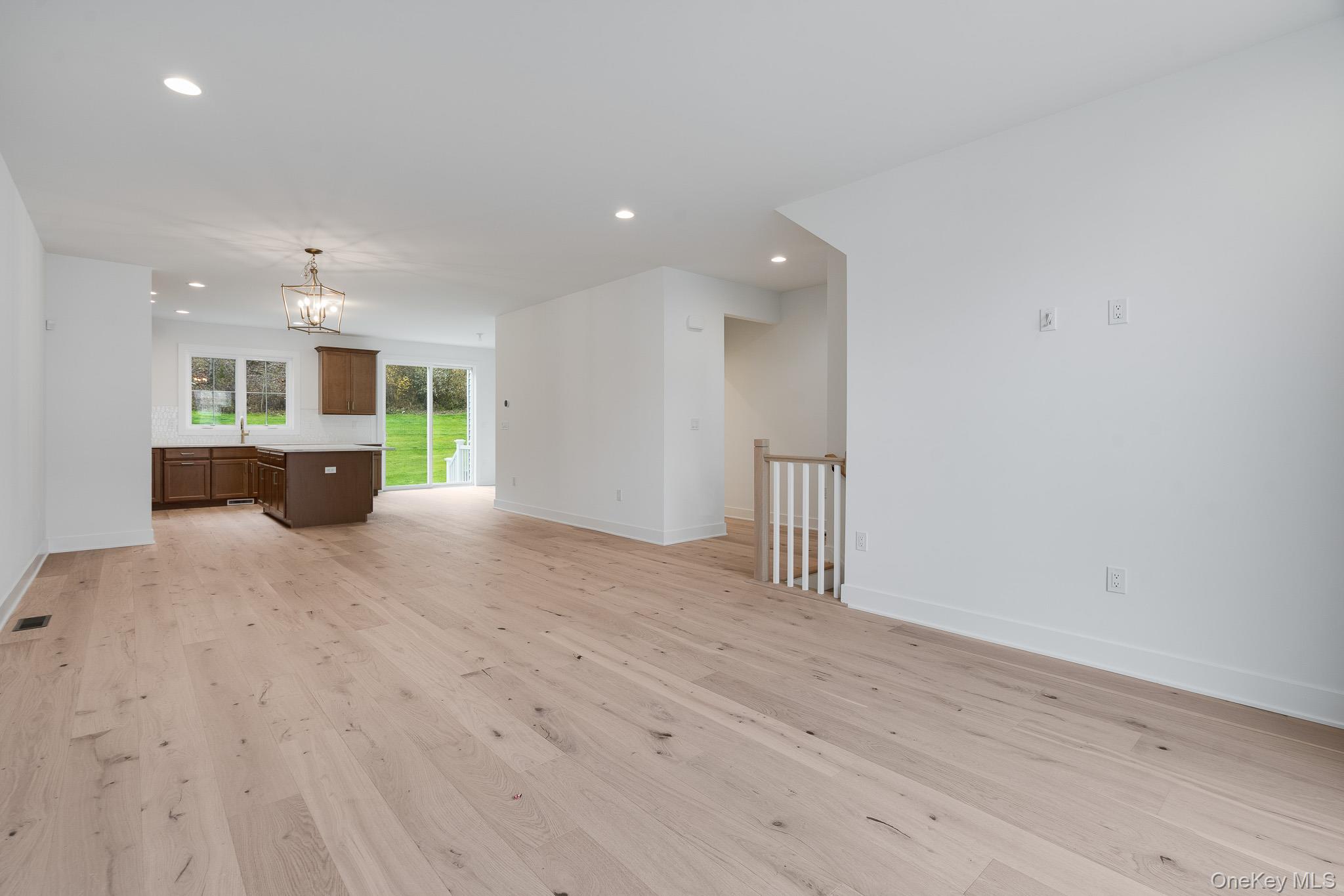 4044 Chestnut Rdg Road Fishkill, NY 12524 - Photo 24 of 26 an empty room with wooden floor and windows