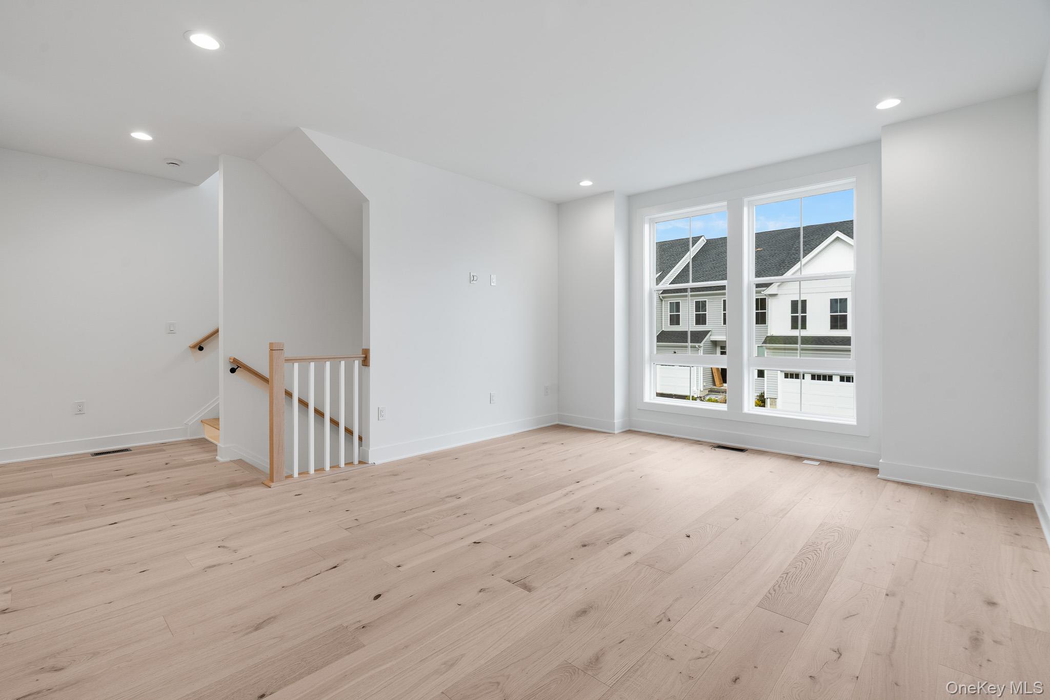 4044 Chestnut Rdg Road Fishkill, NY 12524 - Photo 6 of 26 a view of an empty room with a window and wooden floor