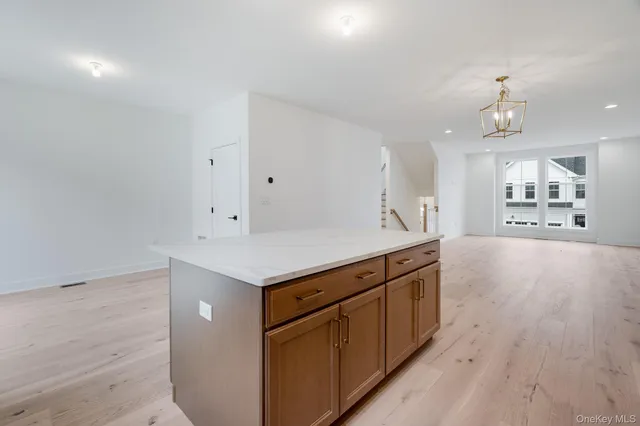 a kitchen with a stove and a refrigerator