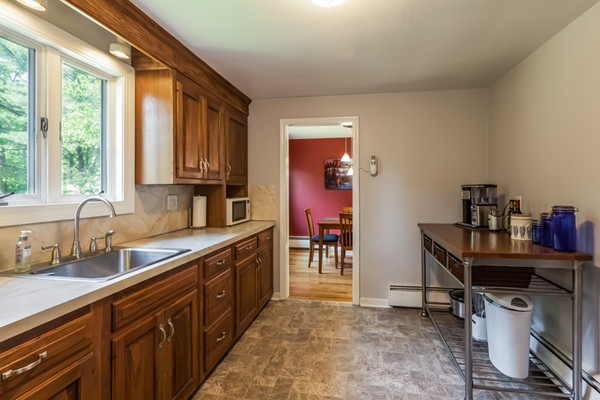 47 Ansie Road Chelmsford, MA 01824 - Photo 11 of 26 a kitchen with granite countertop a sink cabinets and window