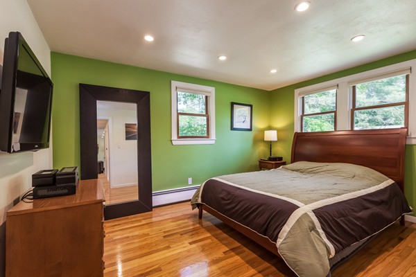 47 Ansie Road Chelmsford, MA 01824 - Photo 12 of 26 a bedroom with a large bed and a flat screen tv