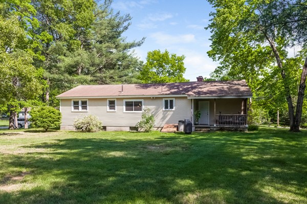 47 Ansie Road Chelmsford, MA 01824 - Photo 23 of 26 a view of a house with a yard and sitting area