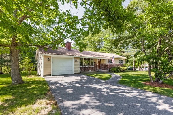 47 Ansie Road Chelmsford, MA 01824 - Photo 3 of 26 a front view of a house with a yard and trees