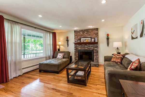 47 Ansie Road Chelmsford, MA 01824 - Photo 4 of 26 a living room with furniture and a fireplace