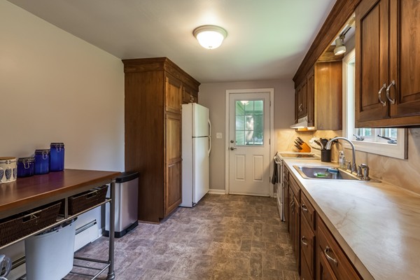 47 Ansie Road Chelmsford, MA 01824 - Photo 9 of 26 a kitchen with a sink stove and refrigerator