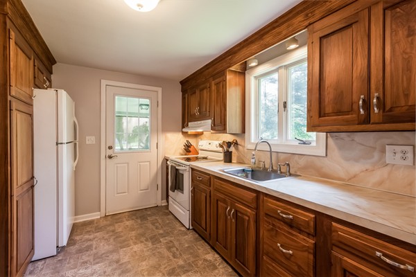 47 Ansie Road Chelmsford, MA 01824 - Photo 10 of 26 a kitchen with stainless steel appliances granite countertop a refrigerator and a sink