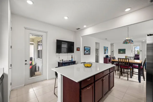 a kitchen with a table and chairs