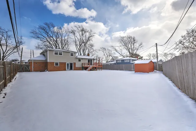 a view of road with snow on the roadside