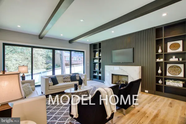 a living room with furniture wooden floor and a table