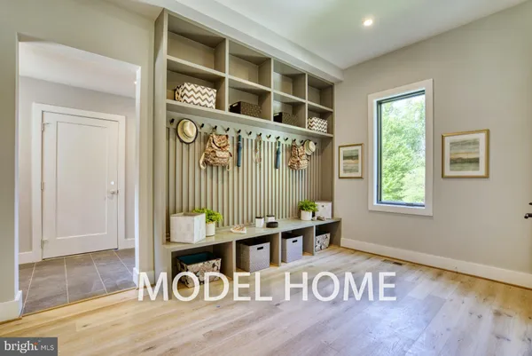 a bathroom with a granite countertop toilet sink and mirror