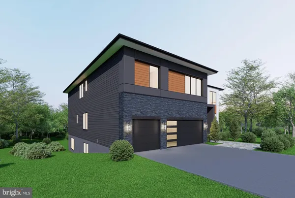 a front view of a house with a garden and yard