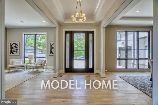 a view of an entryway with wooden floor and door