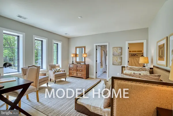a large living room with lots of furniture and a large window