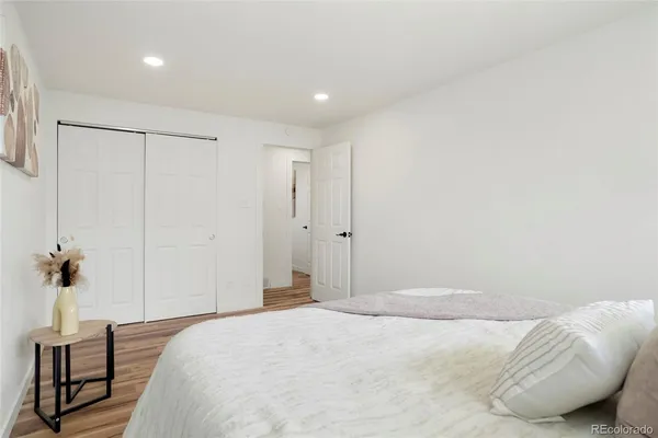 a bedroom with a bed and a table