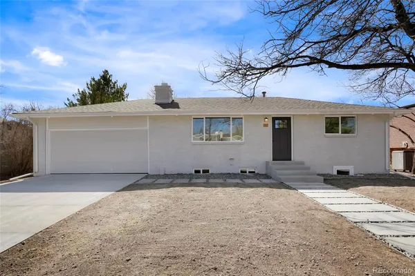 a view of a house with a snow in the yard