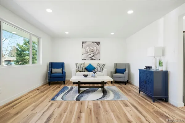 a view of a workspace with furniture and window