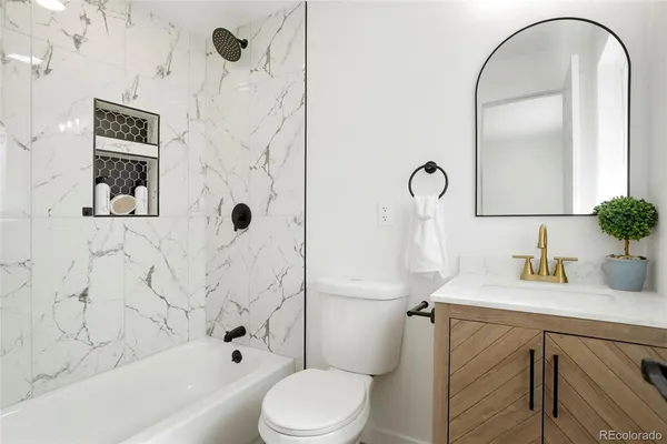 a bedroom with a bed and a chair