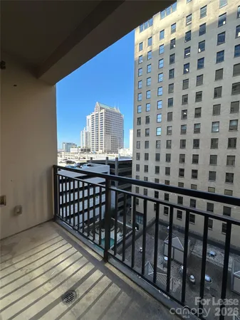 a view of a balcony with wooden floor