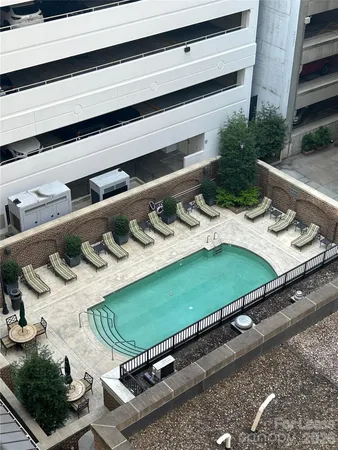 a green field with lots of white chairs