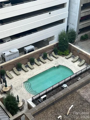 a green field with lots of white chairs