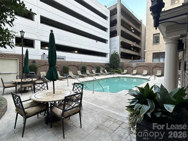 a view of a chairs and table in the patio